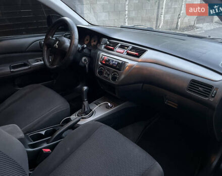 Черный Мицубиси Лансер, объемом двигателя 1.58 л и пробегом 278 тыс. км за 4800 $, фото 8 на Automoto.ua