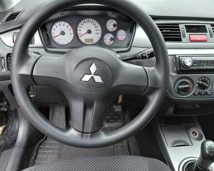 Чорний Міцубісі Lancer, об'ємом двигуна 1.58 л та пробігом 201 тис. км за 4500 $, фото 6 на Automoto.ua