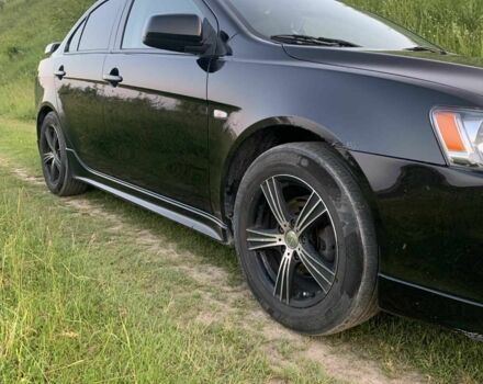 Черный Мицубиси Лансер, объемом двигателя 2 л и пробегом 208 тыс. км за 4300 $, фото 3 на Automoto.ua