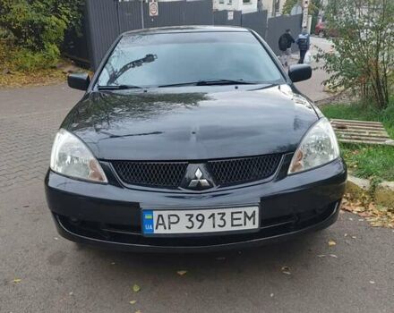 Чорний Міцубісі Lancer, об'ємом двигуна 1.58 л та пробігом 190 тис. км за 3750 $, фото 17 на Automoto.ua