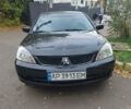 Чорний Міцубісі Lancer, об'ємом двигуна 1.58 л та пробігом 190 тис. км за 3750 $, фото 17 на Automoto.ua