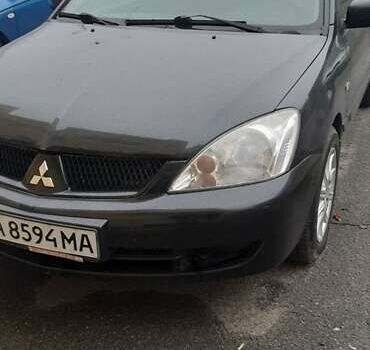 Черный Мицубиси Лансер, объемом двигателя 1.6 л и пробегом 215 тыс. км за 3900 $, фото 2 на Automoto.ua