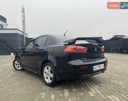 Черный Мицубиси Лансер, объемом двигателя 2 л и пробегом 259 тыс. км за 6500 $, фото 3 на Automoto.ua
