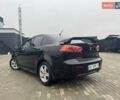 Черный Мицубиси Лансер, объемом двигателя 2 л и пробегом 259 тыс. км за 6500 $, фото 3 на Automoto.ua