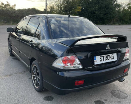 Чорний Міцубісі Lancer, об'ємом двигуна 2 л та пробігом 280 тис. км за 4600 $, фото 16 на Automoto.ua