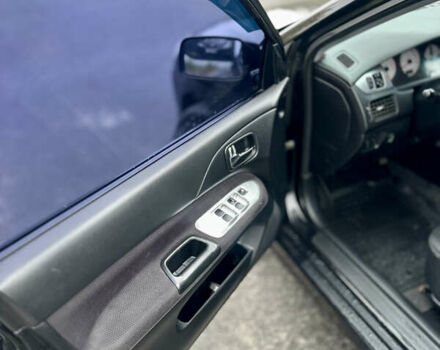 Черный Мицубиси Лансер, объемом двигателя 2 л и пробегом 260 тыс. км за 5300 $, фото 13 на Automoto.ua