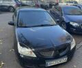 Чорний Міцубісі Lancer, об'ємом двигуна 1.58 л та пробігом 243 тис. км за 3800 $, фото 1 на Automoto.ua