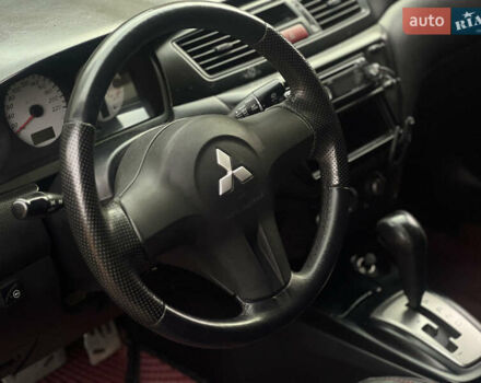 Черный Мицубиси Лансер, объемом двигателя 1.6 л и пробегом 211 тыс. км за 5700 $, фото 22 на Automoto.ua
