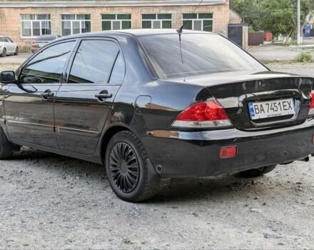 Черный Мицубиси Лансер, объемом двигателя 1.6 л и пробегом 226 тыс. км за 4800 $, фото 2 на Automoto.ua