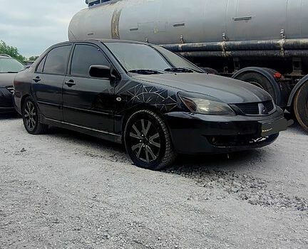 Чорний Міцубісі Lancer, об'ємом двигуна 2 л та пробігом 200 тис. км за 1800 $, фото 5 на Automoto.ua
