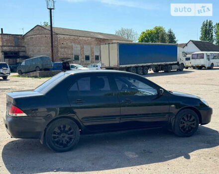 Чорний Міцубісі Lancer, об'ємом двигуна 1.6 л та пробігом 220 тис. км за 4000 $, фото 4 на Automoto.ua