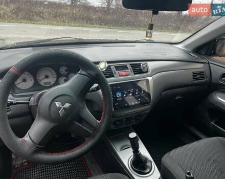 Черный Мицубиси Лансер, объемом двигателя 1.6 л и пробегом 272 тыс. км за 2800 $, фото 14 на Automoto.ua