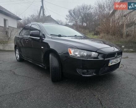 Черный Мицубиси Лансер, объемом двигателя 2 л и пробегом 116 тыс. км за 7200 $, фото 1 на Automoto.ua