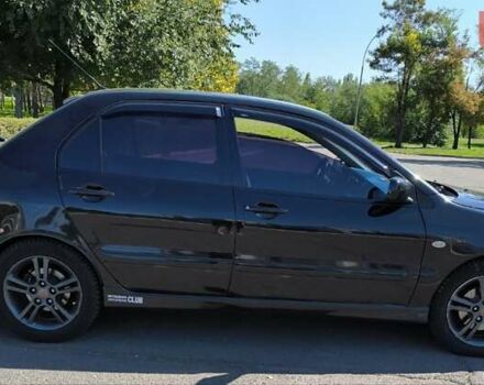Чорний Міцубісі Lancer, об'ємом двигуна 2 л та пробігом 161 тис. км за 5000 $, фото 2 на Automoto.ua