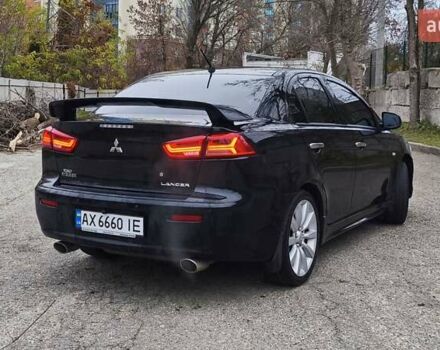 Черный Мицубиси Лансер, объемом двигателя 2 л и пробегом 230 тыс. км за 7100 $, фото 5 на Automoto.ua