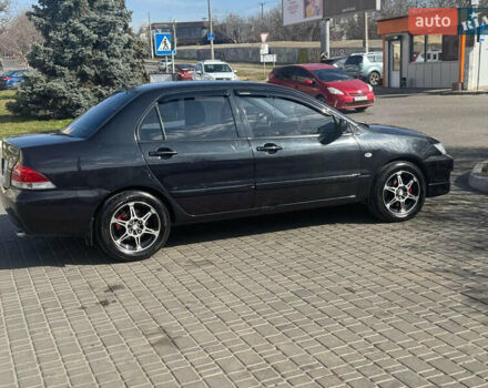 Чорний Міцубісі Lancer, об'ємом двигуна 1.59 л та пробігом 300 тис. км за 3400 $, фото 5 на Automoto.ua