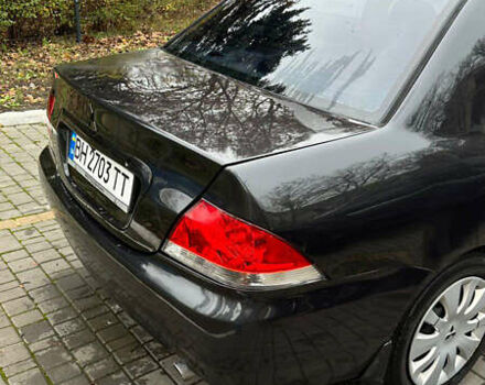 Чорний Міцубісі Lancer, об'ємом двигуна 1.59 л та пробігом 300 тис. км за 3400 $, фото 13 на Automoto.ua