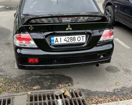 Черный Мицубиси Лансер, объемом двигателя 2 л и пробегом 219 тыс. км за 4400 $, фото 9 на Automoto.ua