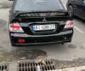 Черный Мицубиси Лансер, объемом двигателя 2 л и пробегом 219 тыс. км за 4400 $, фото 9 на Automoto.ua