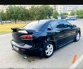 Черный Мицубиси Лансер, объемом двигателя 2 л и пробегом 141 тыс. км за 7200 $, фото 5 на Automoto.ua