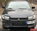Черный Мицубиси Лансер, объемом двигателя 2 л и пробегом 300 тыс. км за 6600 $, фото 1 на Automoto.ua