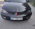 Чорний Міцубісі Lancer, об'ємом двигуна 1.6 л та пробігом 210 тис. км за 4300 $, фото 1 на Automoto.ua