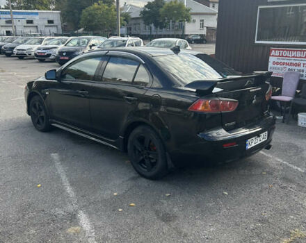 Черный Мицубиси Лансер, объемом двигателя 2 л и пробегом 208 тыс. км за 6500 $, фото 5 на Automoto.ua