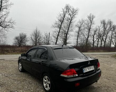 Черный Мицубиси Лансер, объемом двигателя 1.6 л и пробегом 272 тыс. км за 2800 $, фото 2 на Automoto.ua