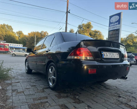 Черный Мицубиси Лансер, объемом двигателя 1.59 л и пробегом 269 тыс. км за 4999 $, фото 1 на Automoto.ua