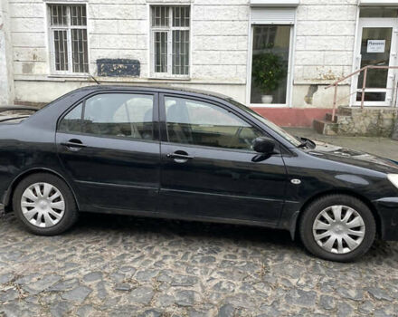 Чорний Міцубісі Lancer, об'ємом двигуна 1.6 л та пробігом 213 тис. км за 3000 $, фото 3 на Automoto.ua