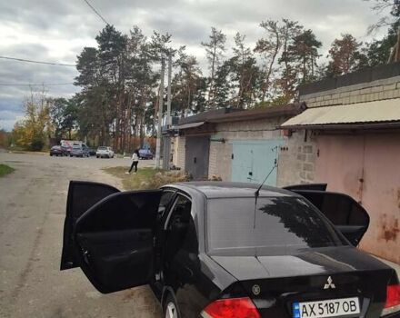 Черный Мицубиси Лансер, объемом двигателя 1.6 л и пробегом 169 тыс. км за 5400 $, фото 3 на Automoto.ua