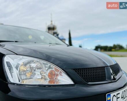 Чорний Міцубісі Lancer, об'ємом двигуна 1.6 л та пробігом 243 тис. км за 4950 $, фото 14 на Automoto.ua