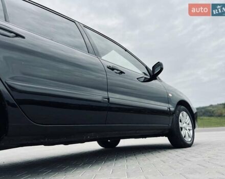 Чорний Міцубісі Lancer, об'ємом двигуна 1.6 л та пробігом 243 тис. км за 4950 $, фото 11 на Automoto.ua