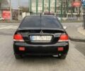 Черный Мицубиси Лансер, объемом двигателя 1.58 л и пробегом 237 тыс. км за 3850 $, фото 4 на Automoto.ua