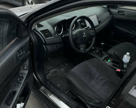 Черный Мицубиси Лансер, объемом двигателя 1.5 л и пробегом 300 тыс. км за 5800 $, фото 3 на Automoto.ua