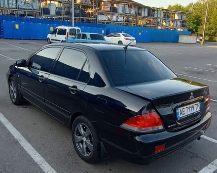 Черный Мицубиси Лансер, объемом двигателя 1.6 л и пробегом 301 тыс. км за 4300 $, фото 2 на Automoto.ua