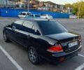 Черный Мицубиси Лансер, объемом двигателя 1.6 л и пробегом 301 тыс. км за 4400 $, фото 2 на Automoto.ua