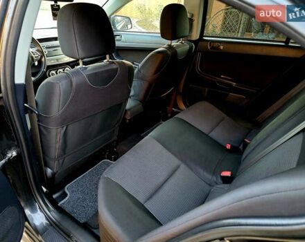 Чорний Міцубісі Lancer, об'ємом двигуна 2 л та пробігом 260 тис. км за 6555 $, фото 30 на Automoto.ua