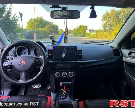 Черный Мицубиси Лансер, объемом двигателя 2 л и пробегом 216 тыс. км за 7500 $, фото 3 на Automoto.ua