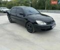 Черный Мицубиси Лансер, объемом двигателя 1.6 л и пробегом 290 тыс. км за 3700 $, фото 1 на Automoto.ua