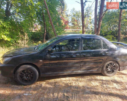 Чорний Міцубісі Lancer, об'ємом двигуна 2 л та пробігом 290 тис. км за 3300 $, фото 1 на Automoto.ua