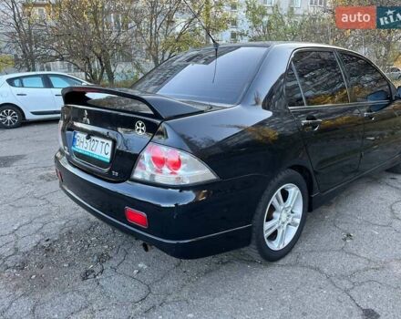 Черный Мицубиси Лансер, объемом двигателя 2 л и пробегом 280 тыс. км за 5400 $, фото 5 на Automoto.ua