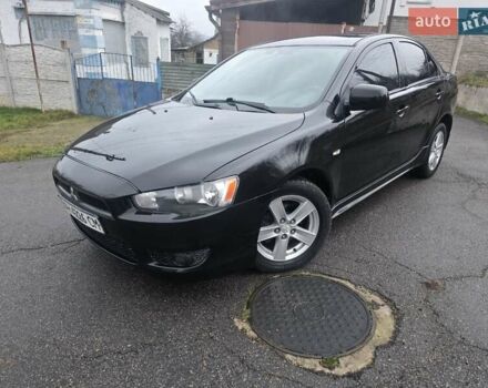 Черный Мицубиси Лансер, объемом двигателя 2 л и пробегом 116 тыс. км за 7200 $, фото 3 на Automoto.ua