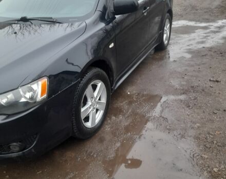 Черный Мицубиси Лансер, объемом двигателя 2 л и пробегом 215 тыс. км за 5700 $, фото 1 на Automoto.ua