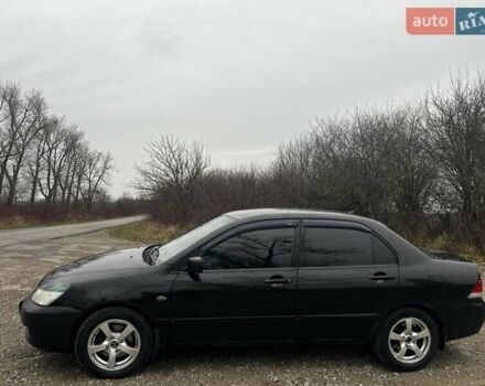 Черный Мицубиси Лансер, объемом двигателя 1.6 л и пробегом 272 тыс. км за 2800 $, фото 2 на Automoto.ua