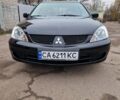 Чорний Міцубісі Lancer, об'ємом двигуна 1.6 л та пробігом 273 тис. км за 3999 $, фото 1 на Automoto.ua