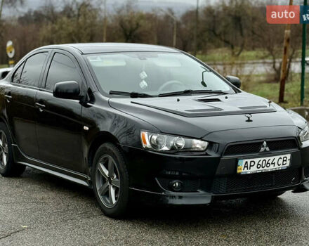 Черный Мицубиси Лансер, объемом двигателя 2 л и пробегом 215 тыс. км за 5500 $, фото 4 на Automoto.ua