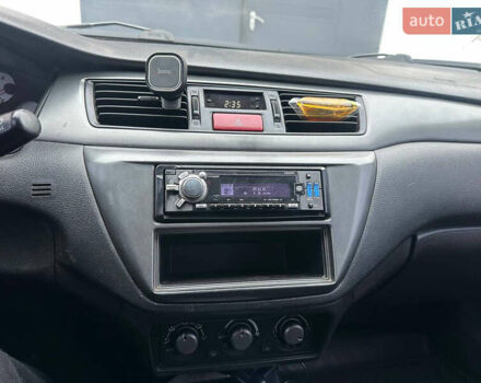 Черный Мицубиси Лансер, объемом двигателя 1.58 л и пробегом 290 тыс. км за 3000 $, фото 9 на Automoto.ua