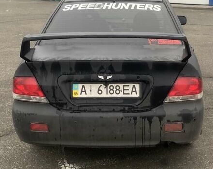 Черный Мицубиси Лансер, объемом двигателя 1.58 л и пробегом 263 тыс. км за 4000 $, фото 36 на Automoto.ua