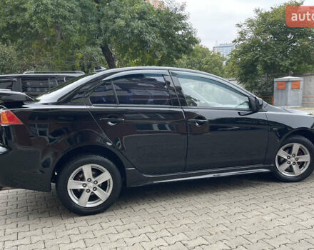 Черный Мицубиси Лансер, объемом двигателя 2 л и пробегом 200 тыс. км за 6199 $, фото 5 на Automoto.ua
